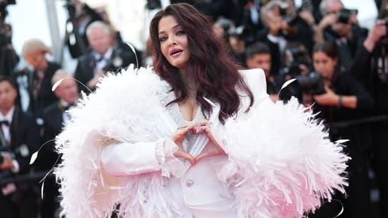 Aishwarya Rai closes Cannes with a bang in the most stylish white tuxedo, feather boa, hair that has never looked better